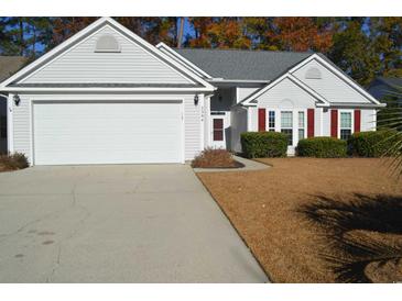 Two-story house with attached garage and landscaping at 2304 Blackbird Ct., Murrells Inlet, SC 29576