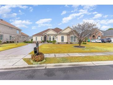 One-story home with stone accents, a large yard, and a two-car garage at 646 Uniola Dr., Myrtle Beach, SC 29579