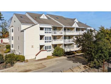 Exterior view of a multi-story condo building with balconies at 1100 Possum Trot Rd. # E235, North Myrtle Beach, SC 29582