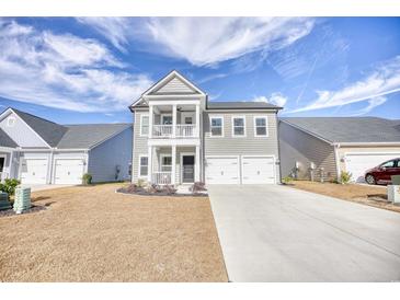 Charming two-story home with a two-car garage and a small front porch at 268 Empyrean Circle, Myrtle Beach, SC 29588