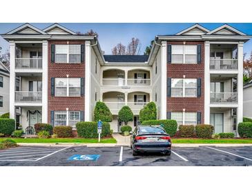 Brick building exterior with ample parking at 1286 River Oaks Dr. # 8-M, Myrtle Beach, SC 29579