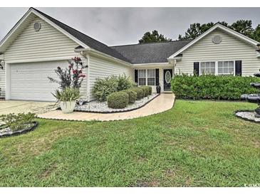 Nice curb appeal! This charming house features a well-manicured lawn and walkway at 2707 Wood Creek Ln., Conway, SC 29527