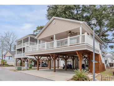 Two-story beach home with large deck and covered parking at 6001-1886 S Kings Hwy., Myrtle Beach, SC 29575