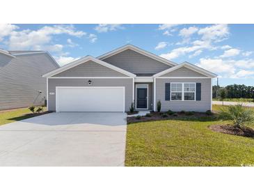 Gray Craftsman style home with white garage door and landscaping at 1473 Nokota Dr., Conway, SC 29526