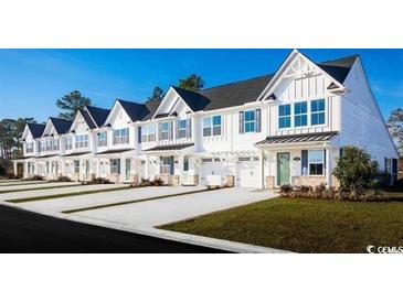 Row of charming townhouses with white exteriors and green accents at 317 Bent Green Ct. # 84B, Murrells Inlet, SC 29576
