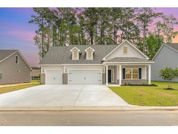 Two-car garage and charming curb appeal at 1308 Crooked Hook Rd., North Myrtle Beach, SC 29582