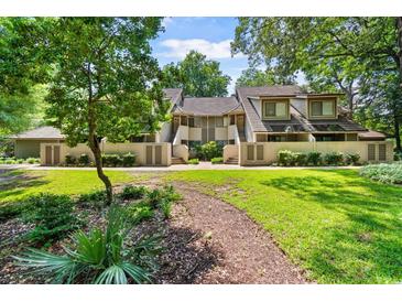 Inviting condo exterior with lush landscaping and a tranquil setting at 204 Baslow Ct. # 20-H, Myrtle Beach, SC 29572