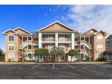 Attractive condo building with parking and landscaping at 4633 Lightkeepers Way # 5-C, Little River, SC 29566