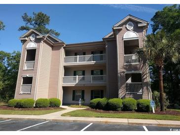 Attractive two-story building with balconies and landscaping at 598 Blue Stem Dr. # 52D, Pawleys Island, SC 29585