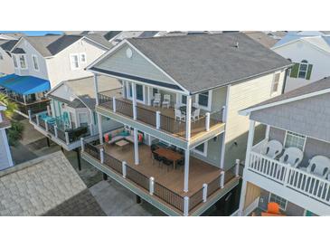 Aerial view of a two-story home with large decks and ocean views at 6001 - 1081 S Kings Hwy., Myrtle Beach, SC 29575