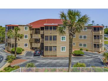 Two-story building with parking and palm trees at 609 Hillside Dr. S # D-17, North Myrtle Beach, SC 29582
