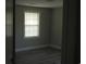 Simple bedroom with wood-look floors and a window with blinds at 209 A/B 26Th Ave. S, Myrtle Beach, SC 29577