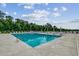 Community pool with plenty of lounge chairs and umbrellas at Tbd1 Kapalua Loop, Little River, SC 29566