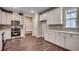 Open kitchen with white cabinets and stainless steel appliances at Tbd1 Kapalua Loop, Little River, SC 29566