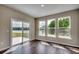 Bright sunroom with sliding glass doors leading to a pond view at Tbd1 Kapalua Loop, Little River, SC 29566