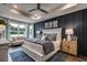 Spacious main bedroom with a cozy sitting area and dark accent wall at Tbd2 Kapalua Loop, Little River, SC 29566