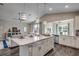 Open concept kitchen with island and white cabinetry at Tbd2 Kapalua Loop, Little River, SC 29566