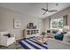 Bright living room features comfy seating, a stylish rug, and large windows at Tbd2 Kapalua Loop, Little River, SC 29566