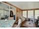 Spacious sunroom with a dining table, couch, and access to the home at 894 S Marlin Circle, Murrells Inlet, SC 29576