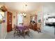 Charming dining room with a round table and wooden hutch at 894 S Marlin Circle, Murrells Inlet, SC 29576