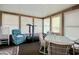 Bright sunroom features ample windows, comfy seating, and a dining area at 894 S Marlin Circle, Murrells Inlet, SC 29576