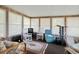 Relaxing sunroom with rocking chairs, TV, and additional seating at 894 S Marlin Circle, Murrells Inlet, SC 29576