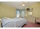 Cozy bedroom with light yellow floral wallpaper and a double bed at 894 S Marlin Circle, Murrells Inlet, SC 29576