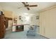 Spacious living room with a ceiling fan and built-in shelving at 894 S Marlin Circle, Murrells Inlet, SC 29576
