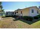 Ranch style mobile home with mature landscaping and walkway at 894 S Marlin Circle, Murrells Inlet, SC 29576
