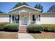 House exterior features a covered porch and brick steps at 894 S Marlin Circle, Murrells Inlet, SC 29576