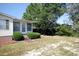 Home's exterior showcases a well-maintained lawn and shrubbery at 894 S Marlin Circle, Murrells Inlet, SC 29576
