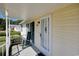 Covered porch with rocking chair, offering curb appeal at 894 S Marlin Circle, Murrells Inlet, SC 29576