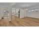 Open dining room with hardwood floors and views into adjacent kitchen and living room at 1228 Colusa Ct., Little River, SC 29566
