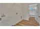 Laundry room with utility sink, shelving, and access to a mudroom at 1228 Colusa Ct., Little River, SC 29566