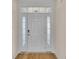 Elegant front door entry with sidelights and wood flooring at 1228 Colusa Ct., Little River, SC 29566