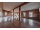 Large living room with hardwood floors and wood walls at 3215 Bluff Rd., Marion, SC 29571