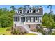 Two story home with gray siding, brick base and white trim at 43 Melbourne Ct., Murrells Inlet, SC 29576