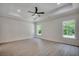 Large bedroom with hardwood floors and ceiling fan at 329 Spinney Dr., Little River, SC 29566