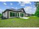Brick house with a large backyard and sunroom at 329 Spinney Dr., Little River, SC 29566