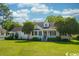 Charming one-story home with white siding, and manicured lawn at 1002 Evans Rd., Marion, SC 29571