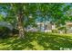 Large backyard with mature shade tree and patio at 1002 Evans Rd., Marion, SC 29571