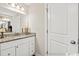 Bathroom with granite countertop, white cabinets, and linen closet at 2815 Biscane Ct., Conway, SC 29527