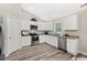Modern kitchen with white cabinets and granite countertops at 2815 Biscane Ct., Conway, SC 29527