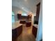Spacious kitchen with dark wood cabinets and an island at 333 William St., Myrtle Beach, SC 29577