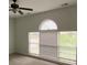 Bright bedroom featuring an arched window and ceiling fan at 333 William St., Myrtle Beach, SC 29577