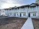 Two story townhouses with gray siding, stone accents and balconies at 780 Maxine Ct. # 8D, Myrtle Beach, SC 29577