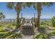 Wooden steps leading from the property to the sandy beach at 2207 S Ocean Blvd. # 307, Myrtle Beach, SC 29577