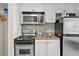 Small kitchen with stove, microwave and refrigerator at 2207 S Ocean Blvd. # 307, Myrtle Beach, SC 29577