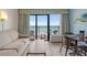 Living room with ocean view and balcony access at 2207 S Ocean Blvd. # 307, Myrtle Beach, SC 29577