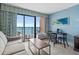 Living room with ocean view, balcony access, and seating at 2207 S Ocean Blvd. # 307, Myrtle Beach, SC 29577
